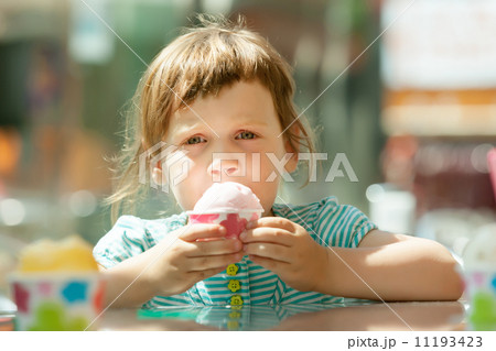 girl eating ice cream girl eating ice cream 11193423