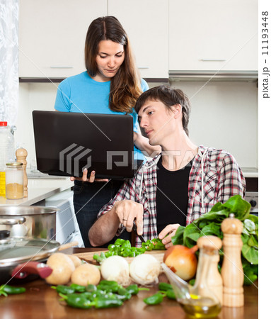 girl shows the new recipe on laptop girl shows the new recipe on laptop 11193448