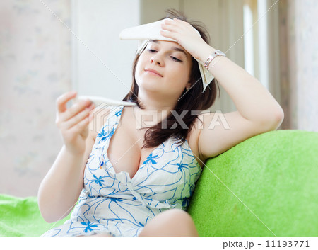 woman having temperature 11193771