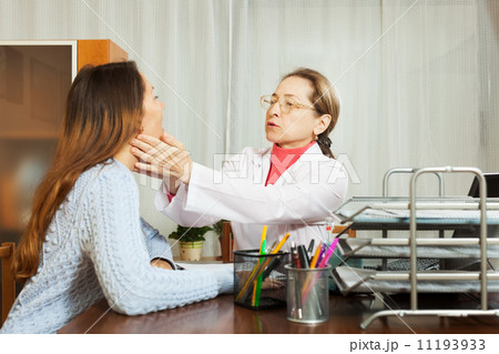 Doctor touching gizzard of girl Doctor touching gizzard of girl 11193933