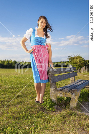 woman in bavarian traditional dirndl 11206486