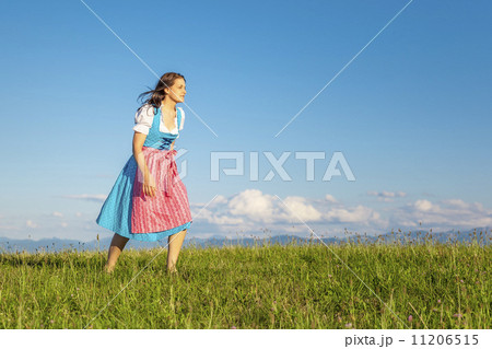 woman in bavarian traditional dirndl woman in bavarian traditional dirndl 11206515