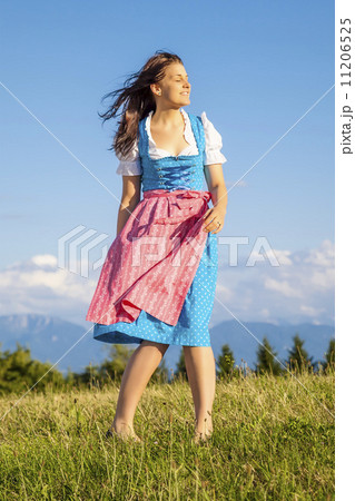 woman in bavarian traditional dirndl 11206525