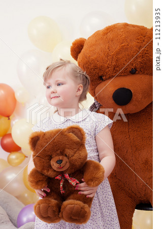 Funny blonde girl posing with teddy bears 11213935