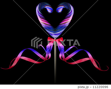 Bright colorful lollipop over black background Bright colorful lollipop over black background 11220096