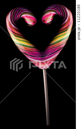 Bright colorful lollipop over black background 11220186