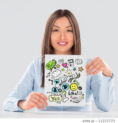 Business woman holding a sign with online services symbols Business woman holding a sign with online services symbols 11225723