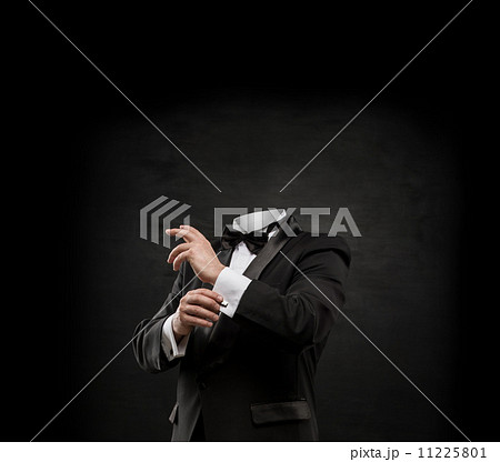 Man without head on dark concrete background 11225801