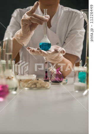 Researcher holding glass test-tube Researcher holding glass test-tube 11226449