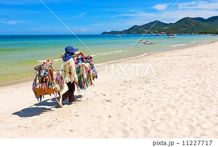 Thai woman selling beachwear at beach in Koh Samui, Thailand. Thai woman selling beachwear at beach in Koh Samui, Thailand. 11227717