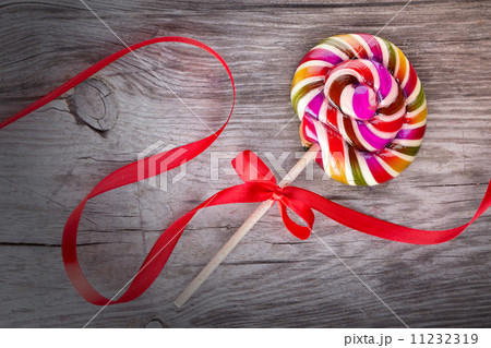 Bright colorful lollipop on wooden table Bright colorful lollipop on wooden table 11232319