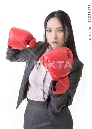 Business woman with boxing gloves Business woman with boxing gloves 11233478