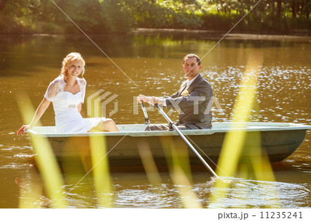 Young just married bride and groom on boat Young just married bride and groom on boat 11235241
