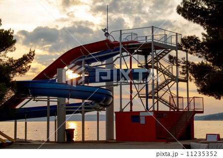 Sunset over tobbogan on beach 11235352