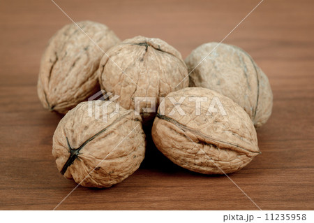 walnuts on wooden background walnuts on wooden background 11235958