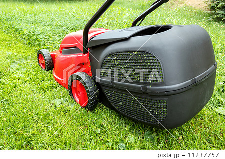 new lawnmower on green grass 11237757