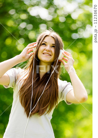 Young woman concentrating on her music 11238670