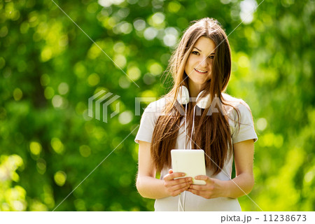 Beautiful young woman listening to music Beautiful young woman listening to music 11238673