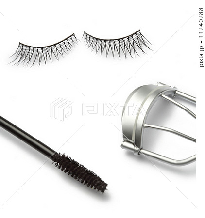 fake false eyelash with eyelash curler and mascara on white  11240288