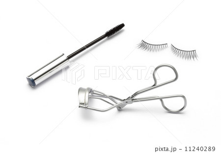 fake false eyelash with eyelash curler and mascara on white  11240289