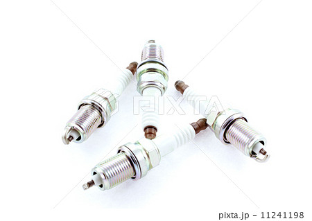 Four Spark Plugs on a white background 11241198
