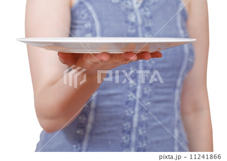 woman holds empty white plate on hand woman holds empty white plate on hand 11241866