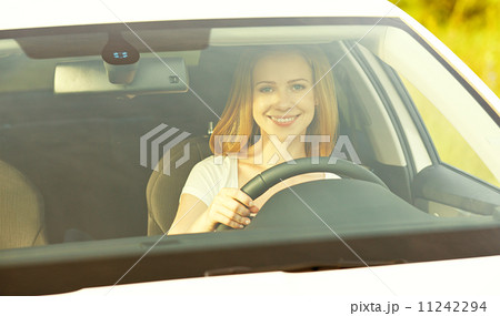 female driver driving a car female driver driving a car 11242294