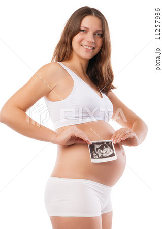 Pregnant woman is holding photo of her Ultrasound Pregnant woman is holding photo of her Ultrasound 11257936
