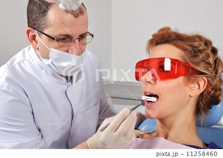 dentist inserts swab 11258460