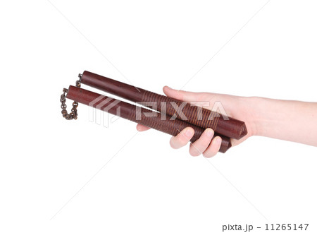 Hand holding nunchaku weapon. 11265147
