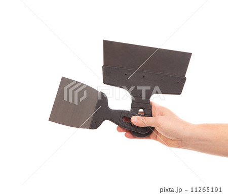 Two metal spatulas in hand 11265191
