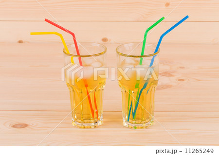 Two glasses full of apple juice. Two glasses full of apple juice. 11265249