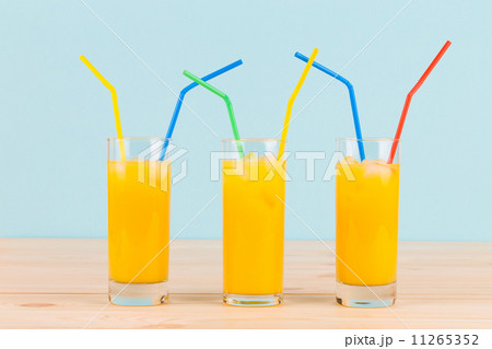 Orange juice on wooden table. 11265352