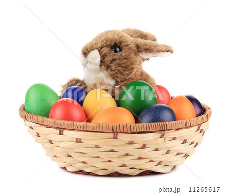 Fluffy foxy rabbit in basket with Easter eggs. 11265617