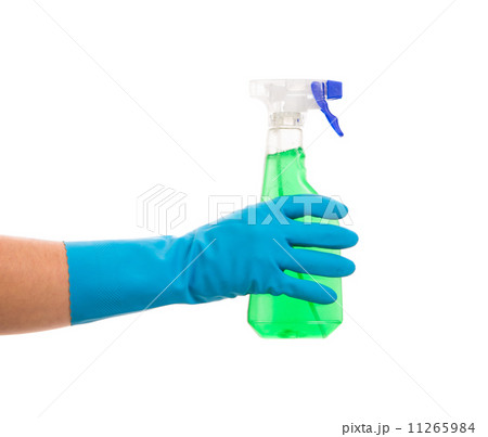 Hand in gloves holds spray bottle. 11265984