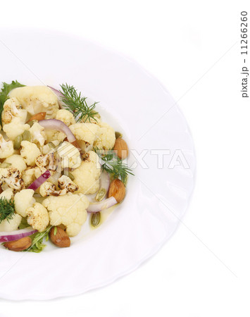 Cauliflower salad with nuts and red onion. 11266260