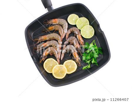Raw shrimps on frying pan. 11266407