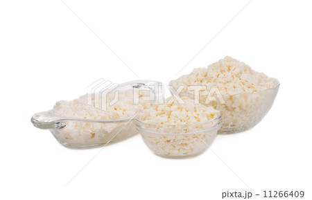 Fresh cottage cheese in bowls. 11266409
