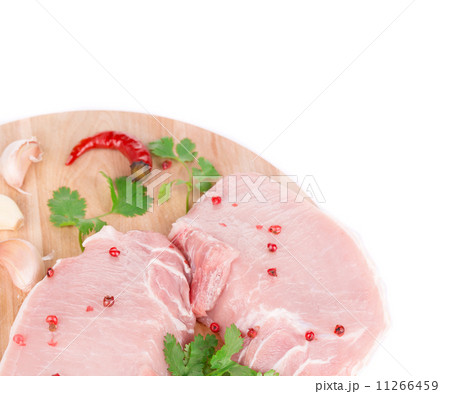 Meat on wooden platter. Meat on wooden platter. 11266459