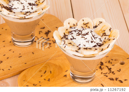 Delicious banana dessert on wood table. Delicious banana dessert on wood table. 11267192