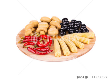 Marinaded vegetables on wooden platter. 11267295