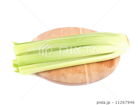 Fresh celery on wooden platter. 11267946