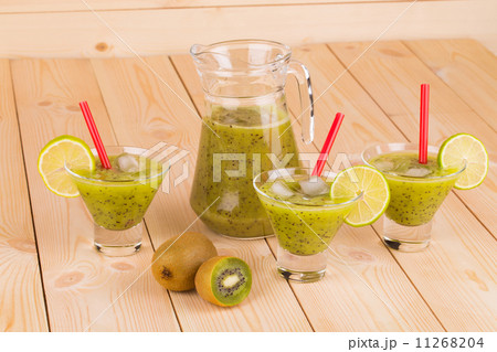 Kiwi fruits whole and mixed in glass. Kiwi fruits whole and mixed in glass. 11268204