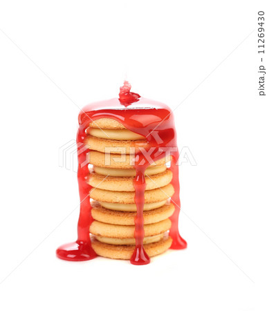 Stack of cookie biscuits in strawberry sauce. Stack of cookie biscuits in strawberry sauce. 11269430