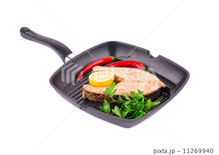 Fried salmon steak on pan. 11269940