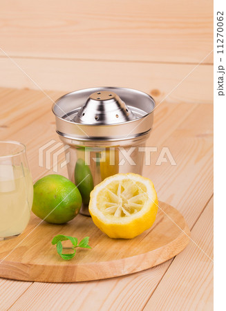 Close up of metal squeezer on cutting board. 11270062