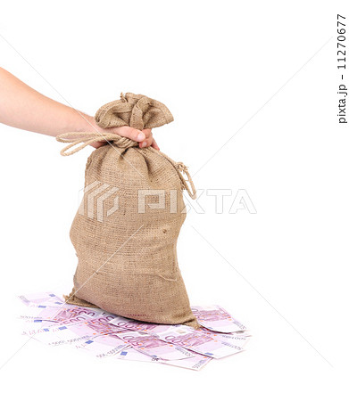 Hand holds bag with euro banknotes. Hand holds bag with euro banknotes. 11270677