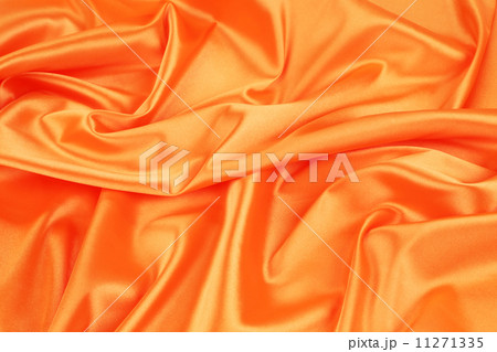 Closeup of elegant shiny orange silk background. 11271335
