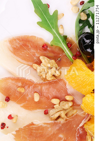 Salad with arugula and prosciutto. Salad with arugula and prosciutto. 11271754