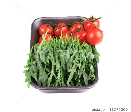 Fresh arugula and juicy tomatoes. Fresh arugula and juicy tomatoes. 11272009